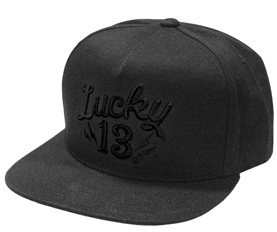 The Lucky 13 Shocker solid twill snapback trucker cap has the vintage-inspired "Lucky 13" graphic on front and a "Lightning Bolt 13" embroidered on the back left side. There is an adjustable snap back to assist in helping this hat fit almost any size head. Come and and get'em at our Smyrna, TN shop a short ride outside Nashville.

COLOR: BLACK