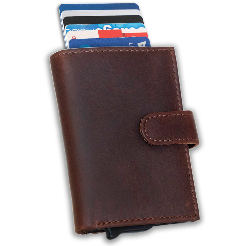 The Nova Auto Pop-Up Wallet is available at our Smyrna, TN shop. A minimalist design and practicality. Made from premium full-grain leather. It offers ample storage for up to 8 cards, an ID, bills, and coins. The unique auto pop-up mechanism allows quick access to your cards with a simple push, while built-in RFID protection keeps your personal information secure.

Wallet Dimensions:&nbsp;4" L x 3" H x .75" D