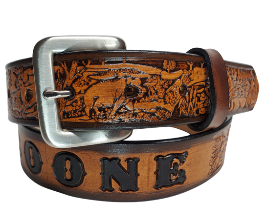 Our Lil Outdoorsmen is just like the Outdoorsmen for dad or mom complete with Hogs, Deer, Fish, Racoon and Squirrel. Full grain American vegetable tanned cowhide approx. 1/8"thick. Width is 1 1/4" and includes Antique Nickle plated Solid Brass buckle. We Hand Finished with a darker brown edge feathered into a tan center. Edges are smooth burnished painted edges. Made in our Smyrna, TN, USA shop. Buckle snaps in place for easy changing if desired.