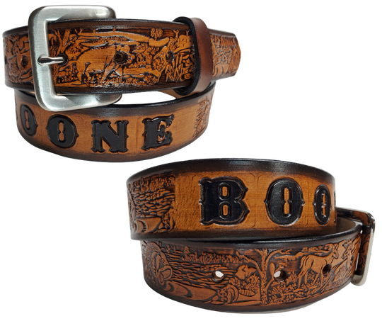 Our Lil Outdoorsmen is just like the Outdoorsmen for dad or mom complete with Hogs, Deer, Fish, Racoon and Squirrel. Full grain American vegetable tanned cowhide approx. 1/8"thick. Width is 1 1/4" and includes Antique Nickle plated Solid Brass buckle. We Hand Finished with a darker brown edge feathered into a tan center. Edges are smooth burnished painted edges. Made in our Smyrna, TN, USA shop. Buckle snaps in place for easy changing if desired.