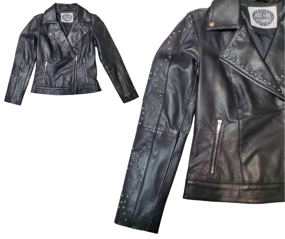 This Studded Black MC&nbsp; Zip front Lamb skin jacket is soft and supple a update of a timeless classic, it features black lining, antique silver hardware, and 3 outside pockets and two inside pockets. Bring your inner rocker! You can find it near Nashville, in Smyrna, TN.  Sizes XS-5XL Call for size availability.
