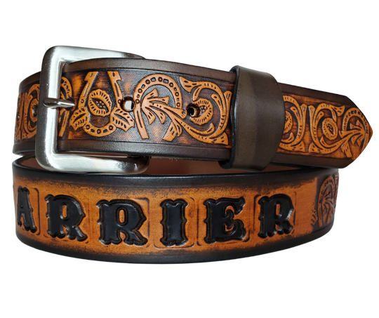 We are always trying to find classic iconic patterns and this is one of those....Horseshoes mixed with a Western scroll pattern. It's a professionally crafted, genuine leather belt made from 8-10 oz cowhide shoulder leather, approximately 1/8" thick. It boasts a hand burnished edge, along with a multi-step dye and finishing technique. The antique nickel plated solid brass buckle is affixed with heavy snaps. This belt is crafted near Nashville, TN in Smyrna.