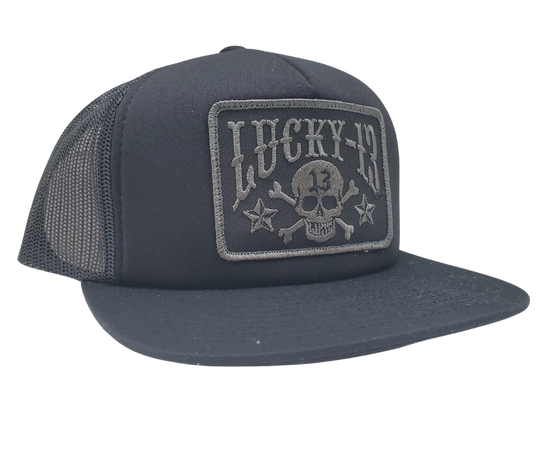 The Lucky 13 Skull and Stars snapback trucker cap has the "Skull and Stars" graphic on front and a "Lighting Bolt 13" embroidered on the back left side. Front is Twill, back is Mesh. There is an adjustable snap back to assist in helping this hat fit almost any size head. Come and and get'em at our Smyrna, TN shop a short ride outside Nashville.

COLOR: BLACK/GREY EMBROIDERY