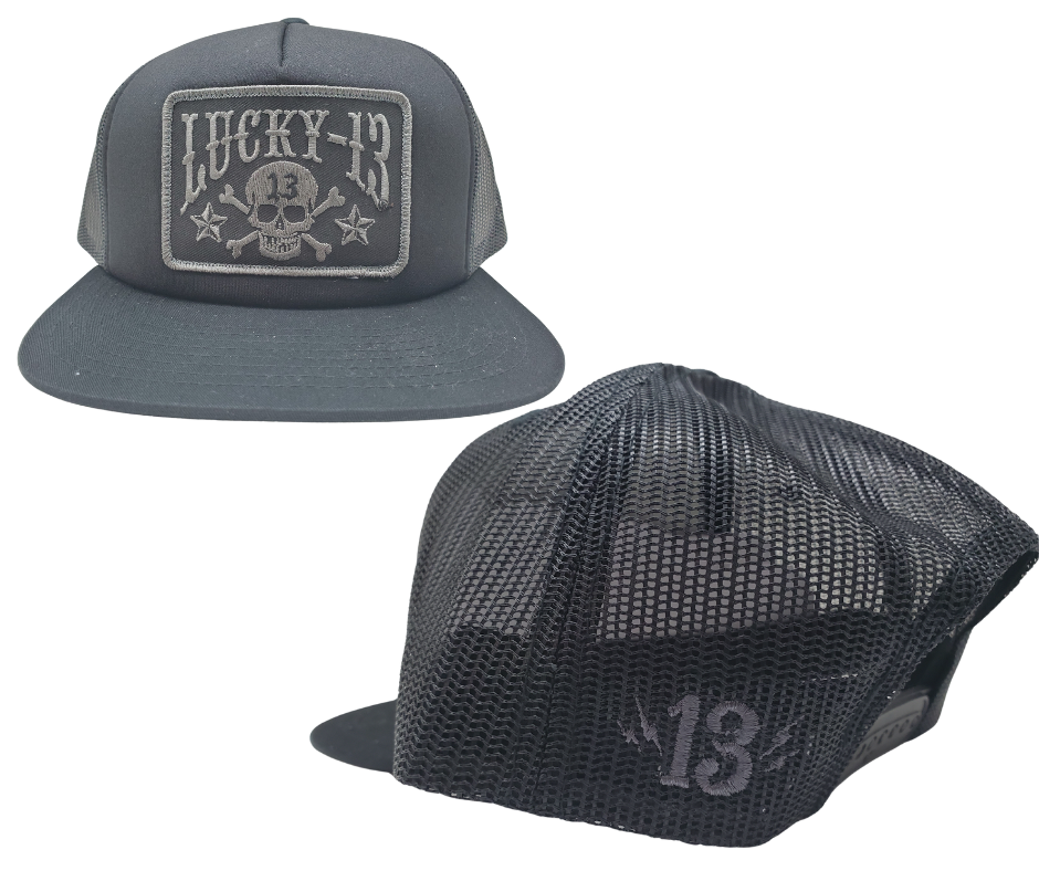 The Lucky 13 Skull and Stars snapback trucker cap has the "Skull and Stars" graphic on front and a "Lighting Bolt 13" embroidered on the back left side. Front is Twill, back is Mesh. There is an adjustable snap back to assist in helping this hat fit almost any size head. Come and and get'em at our Smyrna, TN shop a short ride outside Nashville.

COLOR: BLACK/GREY EMBROIDERY