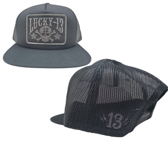 The Lucky 13 Skull and Stars snapback trucker cap has the "Skull and Stars" graphic on front and a "Lighting Bolt 13" embroidered on the back left side. Front is Twill, back is Mesh. There is an adjustable snap back to assist in helping this hat fit almost any size head. Come and and get'em at our Smyrna, TN shop a short ride outside Nashville.

COLOR: BLACK/GREY EMBROIDERY