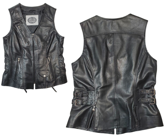 This super soft Lambskin ladies' vest features zippered pockets, V-neck design, and buckle detailing on the sides for a comfortable look. The 3 panel back, lower back zippered gussets, and zipperd front closure add to the practicality of this vest.&nbsp; Visit our leather shop in Smyrna, TN, near Nashville, and choose from sizes small to 5x.  Includes inside Carry conceal pockets, 3 zippered outside pockets  3 panel back with lower gussets for extra comfort