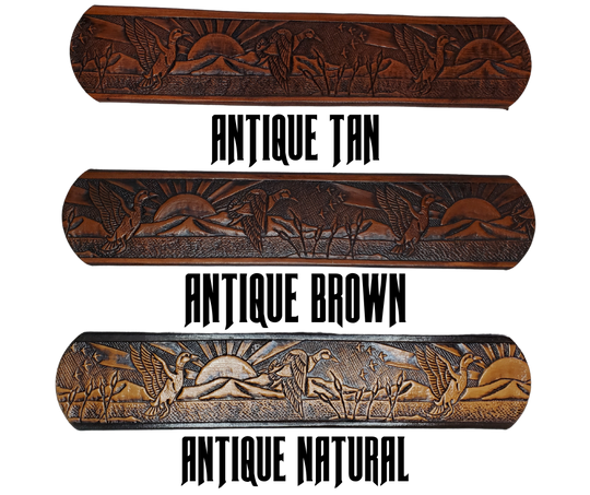 This solid strip of Veg Tan cowhide, is hand stained in 4 brown options, with smooth, finished edges. Embossed with a Mallard Duck scene down length of belt, or have name added to scene up to 8 letters. Belt thickness is approx. 1/8", and 1 1/2" wide. Sizes available are 34" to 44" from buckle end to hole most worn. Attached with 2 snaps is a Brushed Nickel plated solid brass buckle. 