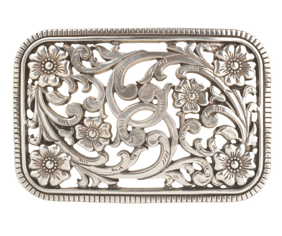 Get the perfect blend of Western and non-Western style with this Antique Silver buckle featuring a Filigreed Vine and Flower scroll design. The rectangular shape with rounded edges and rope design border adds a unique touch to any outfit. It's 3" tall by 4" wide, fitting belts up to 1 1/2" wide. Find it at our retail shop in Smyrna, TN or conveniently purchase it online. Imported