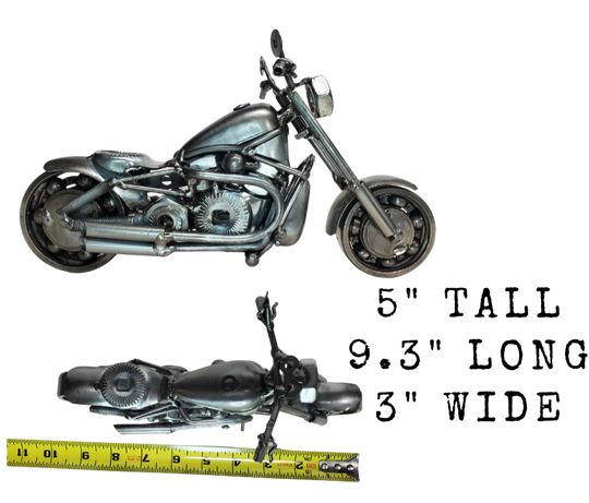 Enhance your Man Cave with this one-of-a-kind motorcycle metal art! A great gift for any motorcycle lover, this piece was crafted with nuts, bolts, washers, springs, and bearing wheels for a unique touch. It even stands on its own, thanks to the kickstand. For specific measurements, please refer to the photo. Motorcycle METAL artwork is currently available at our Smyrna store, just minutes from Nashville, TN.