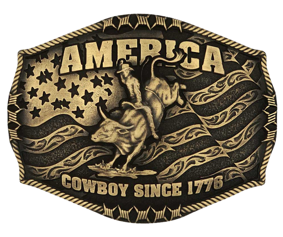 Stand for liberty and Western heritage for all with the Cowboy Since 1776 Attitude Buckle. The waving American flag provides the backdrop for the design. The word "America" sits above the bull rider figure. The words "Cowboy Since 1776" is beneath the bull rider figure. A roped border with barbed wire design creates the edge of the buckle, giving the piece a rustic look. Fits 1.5 inch belts. Find it online or at our shop just outside Nashville in Smyrna, TN.&nbsp;