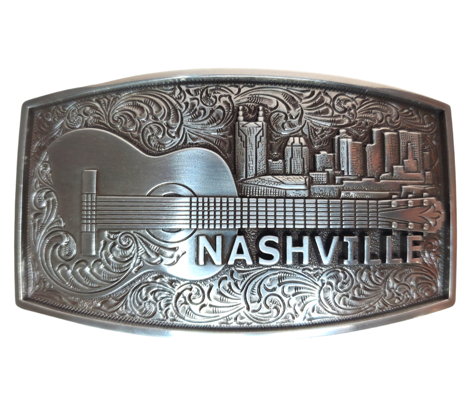 The "NASH" Buckle takes you to the beloved Nashville skyline complete with a whimsical bat tower building and an acoustic guitar. Show off your style with this 2 1/2" by 3 1/2" buckle and be inspired by the city made famous for risk-takers. Get yours online or in our Smyrna, TN shop, just outside Nashville. Dare to shine!