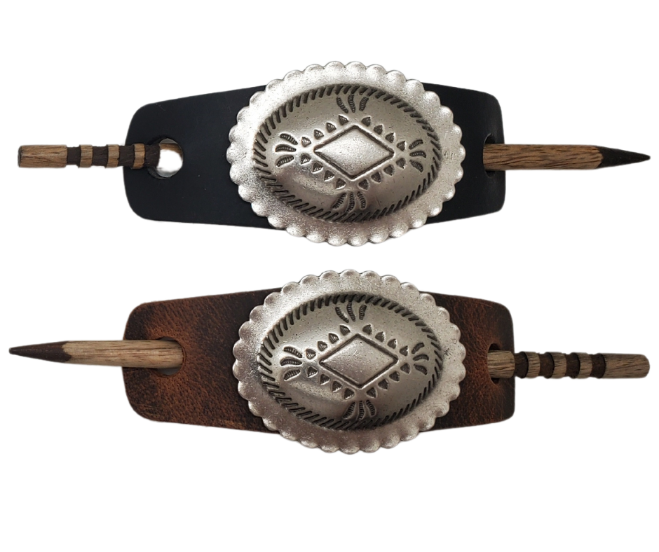 Take your hair barrettes to the next level with our Antique Silver finish Conchos, available in Black or Desert Brown Leather of your choice. Each one comes with an ornate wooden stick to keep your long locks in place. These are proudly made in our Smyrna, TN shop, just a short drive from the famous downtown Nashville.