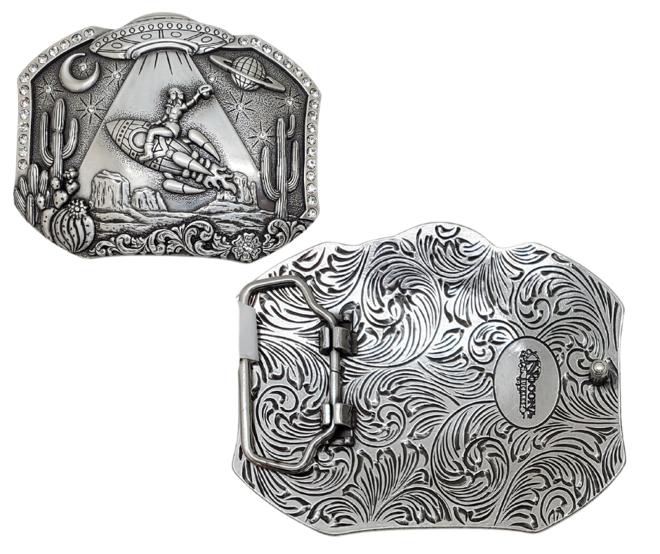 Embrace the perfect combination of the Wild West, Rhinstones and outer space with our "Cosmic Desert" Belt Buckle. This antiqued silver accessory, measuring approx. 3" tall by 4" wide, will effortlessly elevate any outfit. Don't hesitate to add this ultimate Boot Scootin essential to your collection, available for purchase at our retail store in Smyrna, TN or online. Imported.