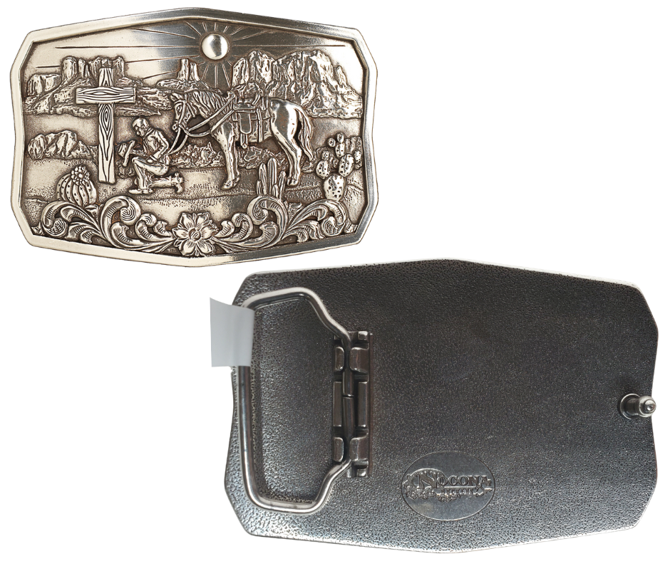 This handsome, one-of-a-kind buckle displays an antiqued silver finish, an old wooden cross, and a cowboy in prayer to our Lord, all against a hot desert backdrop. At approx. 2 1/2" tall and 3 1/2" wide, it fits belts up to 1 1/2" wide and is available for purchase from our physical store in Smyrna, Tennessee as well as our online store. Imported.