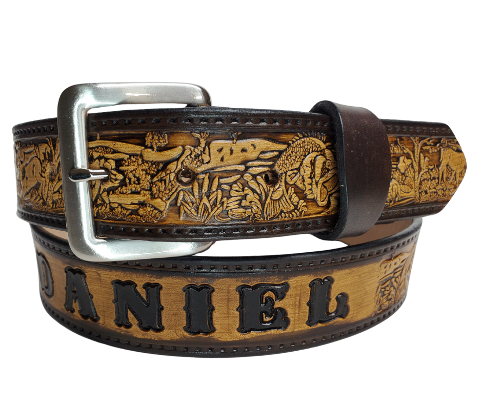 Our Outdoorsman leather belt is crafted from high-quality Veg Tan cowhide and comes in four different color options. The edges are smooth and hand finished. It has Deer, Hogs, Fish, look closely for a Racoon and a Squirrel too. Personalize your belt by adding up to 10 letters. It's 1 1/2" wide, and available in sizes 34" to 44".  The removable Brushed Nickel plated solid brass buckle is attached with two snaps. Handmade in our Smyrna, TN, USA shop, just a short trip from Nashville.