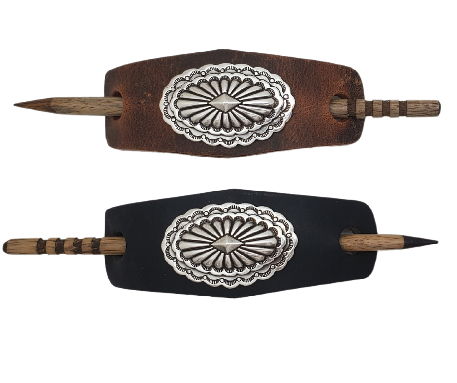 Take your hair barrettes to the next level with our Antique Silver finish Conchos, available in Black or Desert Brown Leather of your choice. Each one comes with an ornate wooden stick to keep your long locks in place. These are proudly made in our Smyrna, TN shop, just a short drive from the famous downtown Nashville.