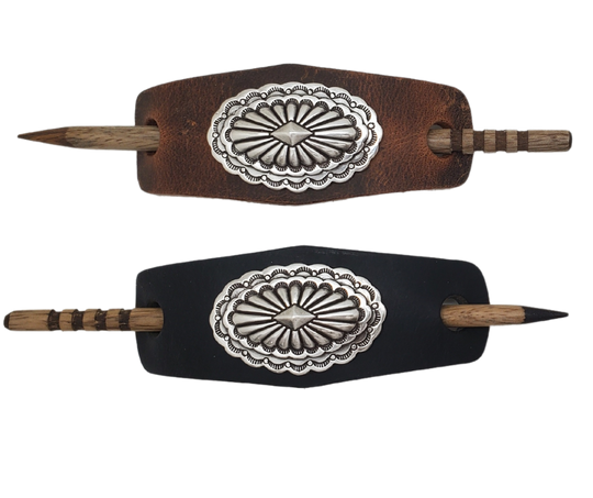 Take your hair barrettes to the next level with our Antique Silver finish Conchos, available in Black or Desert Brown Leather of your choice. Each one comes with an ornate wooden stick to keep your long locks in place. These are proudly made in our Smyrna, TN shop, just a short drive from the famous downtown Nashville.