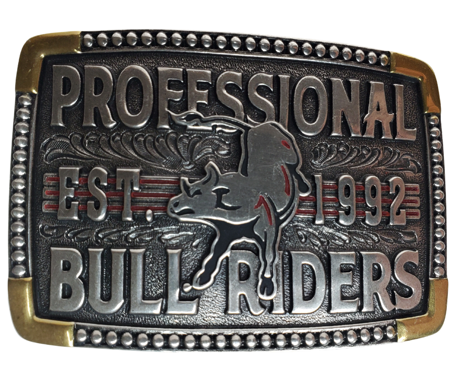 The cast Attitude buckle with PBR colors to make the buckle vibrant and stand out. "Professional Bull Riders" Est. 1992 and Bull in the center with a beaded edge completes the rectangle shape. Fits 1 1/2" belts and is approx. 3" tall x 4"across. Available at our shop just outside Nashville in Smyrna, TN. Made by Montana Silversmith.