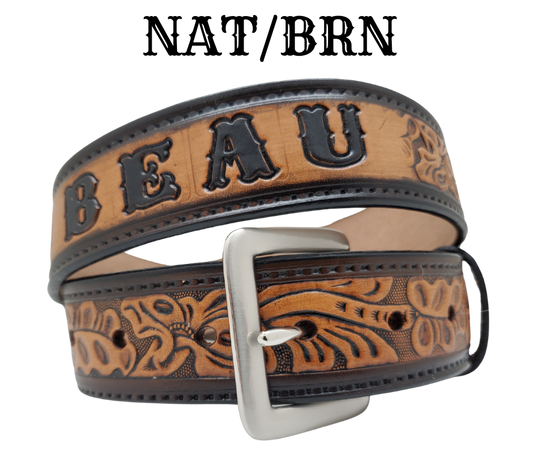 Get ready for an unforgettable Rodeo adventure with The "Pendleton" Name Belt! This one-of-a-kind belt features a 1 1/2" width and is hand-stained with a strip of vegetable tanned leather. The bold design includes a embossed stitch border and Classic Tooled center pattern, while the solid brass buckle in antique nickel finish adds a touch of ruggedness. Handcrafted at our shop in Smyrna, Tennessee, just outside Nashville.