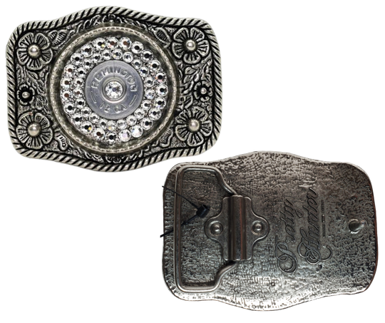 Glamorize your look with this sizzling "Calamity Jane" Buckle! Genuine Swarovski Crystals and flowers create a feminine yet daring outfit accessory. Approx. 3 1/4"" x 2 1/2" antique floral cast pewter base is tastefully topped off with authentic once-fired rounds. Add this trendy item to your wardrobe: Fit's up to 1 1/2" belts. Find it in our Smyrna, TN store near Nashville! Assembled in the USA.