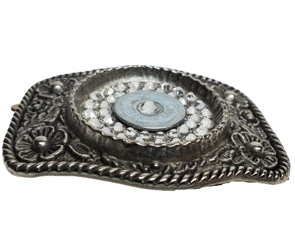 Glamorize your look with this sizzling "Calamity Jane" Buckle! Genuine Swarovski Crystals and flowers create a feminine yet daring outfit accessory. Approx. 3 1/4"" x 2 1/2" antique floral cast pewter base is tastefully topped off with authentic once-fired rounds. Add this trendy item to your wardrobe: Fit's up to 1 1/2" belts. Find it in our Smyrna, TN store near Nashville! Assembled in the USA.