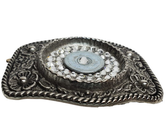 Glamorize your look with this sizzling "Calamity Jane" Buckle! Genuine Swarovski Crystals and flowers create a feminine yet daring outfit accessory. Approx. 3 1/4"" x 2 1/2" antique floral cast pewter base is tastefully topped off with authentic once-fired rounds. Add this trendy item to your wardrobe: Fit's up to 1 1/2" belts. Find it in our Smyrna, TN store near Nashville! Assembled in the USA.