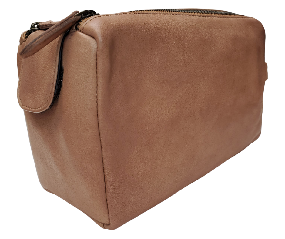 The Representative, a Leather traveling Dopp bag, is available at our Smyrna, TN shop not far from Nashville. It has one outside zip pocket, side handle, and a two-zipper & closure with hook-and-loop securing the end. Spacious main compartment with a zip pocket on one side and three elastic loops on the other side. Lined with a slick fabric.
Bag size: 9.25” x 3.5” x 5.5”