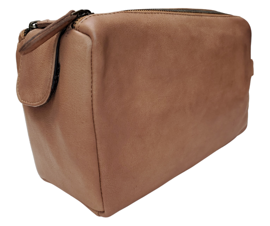 The Representative, a Leather traveling Dopp bag, is available at our Smyrna, TN shop not far from Nashville. It has one outside zip pocket, side handle, and a two-zipper & closure with hook-and-loop securing the end. Spacious main compartment with a zip pocket on one side and three elastic loops on the other side. Lined with a slick fabric.
Bag size: 9.25” x 3.5” x 5.5”