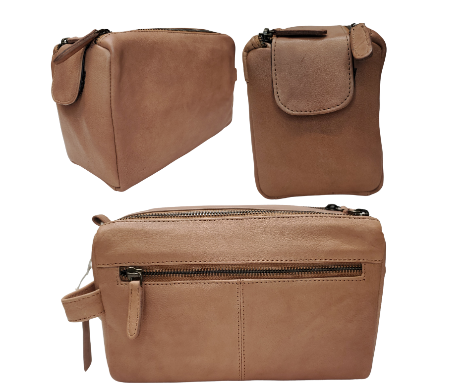 The Representative, a Leather traveling Dopp bag, is available at our Smyrna, TN shop not far from Nashville. It has one outside zip pocket, side handle, and a two-zipper & closure with hook-and-loop securing the end. Spacious main compartment with a zip pocket on one side and three elastic loops on the other side. Lined with a slick fabric.
Bag size: 9.25” x 3.5” x 5.5”