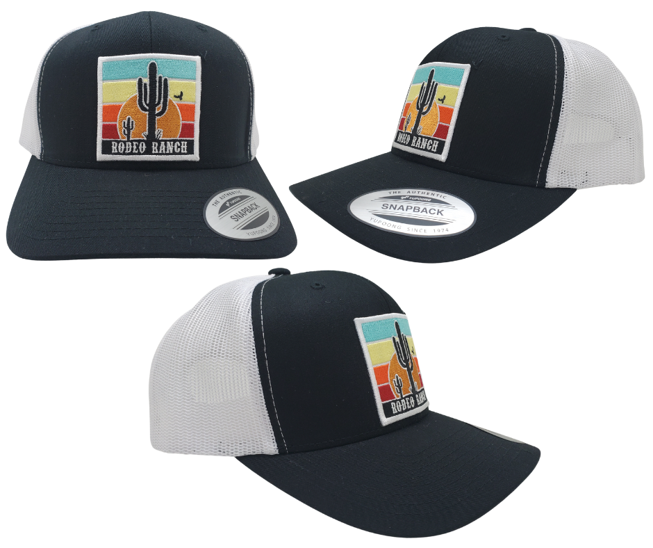 Embrace the thrill of the Rodeo. This Embroidered Trucker Cap features a vibrant desert sun and a towering Cactus. With a Black front, White mesh trucker style, and a snapped adjustable strap, it's ready for any adventure. Visit our Smyrna, TN shop just outside Nashville and claim yours today!