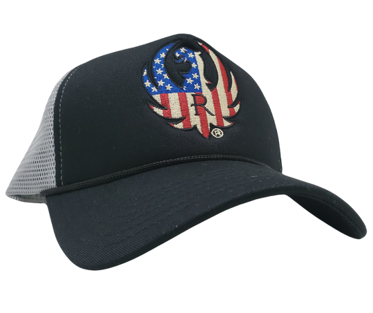 RUGER & Company was created in 1949 when William Ruger and Alexander Sturm took a risk and opened a small machine shop in Connecticut. Since then, we have grown to become a renowned brand. Show your adventurous spirit with our black and grey mesh cap featuring the iconic RUGER logo blended with the USA flag. Shop now at our Smyrna, TN store or online for the ultimate challenge and inspiration.