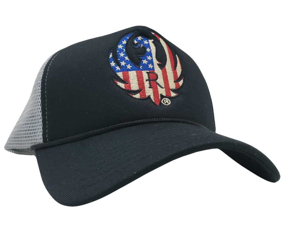 RUGER & Company was created in 1949 when William Ruger and Alexander Sturm took a risk and opened a small machine shop in Connecticut. Since then, we have grown to become a renowned brand. Show your adventurous spirit with our black and grey mesh cap featuring the iconic RUGER logo blended with the USA flag. Shop now at our Smyrna, TN store or online for the ultimate challenge and inspiration.