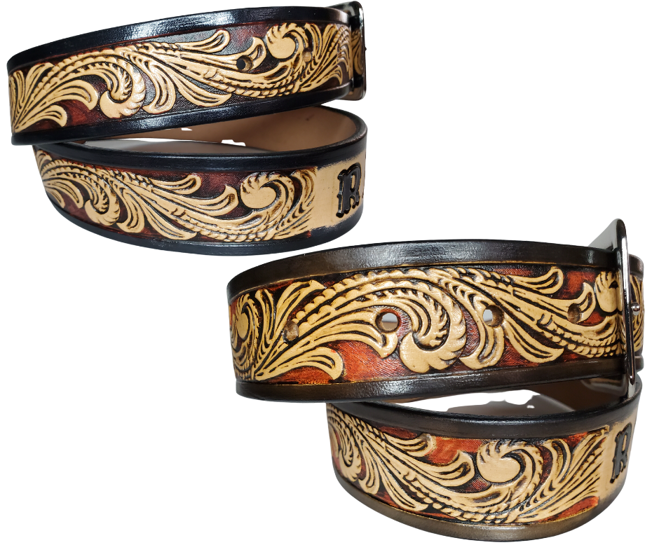 This DELUXE Rustler Name Leather Belt features a classic western Scroll pattern embossed on a 9-10 oz. vegetable-tanned cowhide. You may customize the buckle with the added snaps. It is named Deluxe because of the additional color added to the background of the pattern. This product is crafted with care in our Smyrna, TN shop, just outside Nashville, TN.