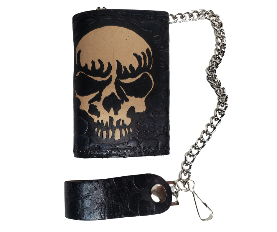 Skulls pattern all leather Tri-fold Chain Wallet. 1 Cash Slot for all your important stash, 3 card slots and 1 underneath the middle slot. It's USA made and Buckle and Hide approved. Approx. 3"x 4" folded. 2 snap closure. Complete with an 12" chrome plated chain including leather belt loop. Available in our Smyrna, TN shop a short drive from downtown Nashville. Like most wallets over stuffing will limit the time of use. Colors may vary from picture. 