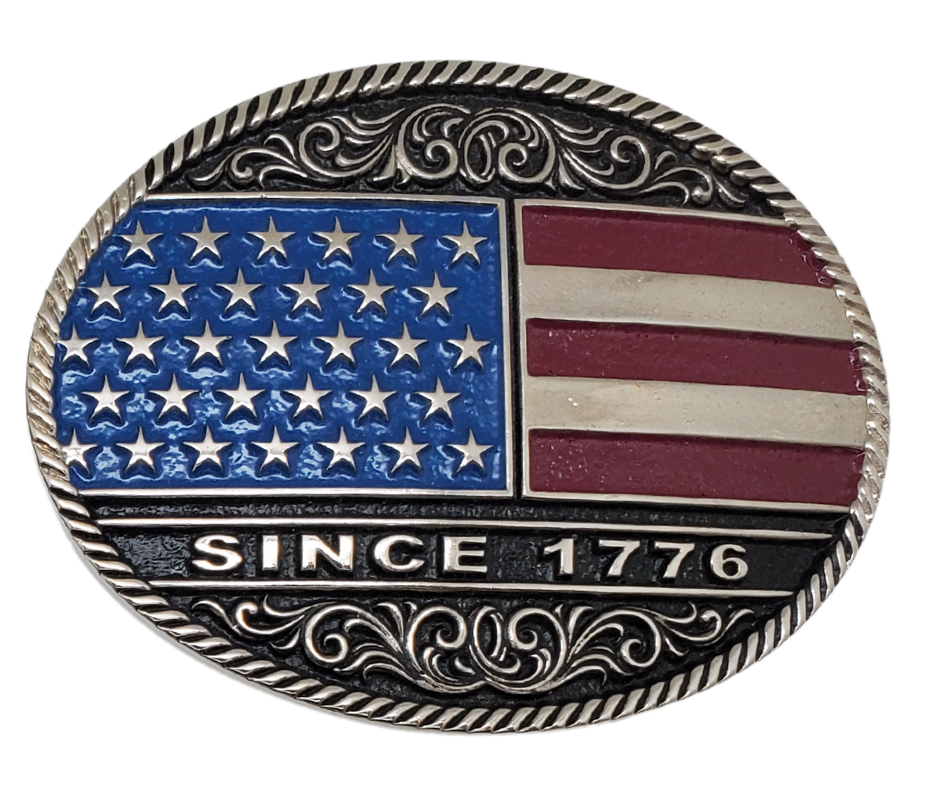 Be a true patriot with The "Declaration" Belt Buckle, featuring a timeless Western Scroll pattern, a rope edge, and iconic Red, White, and Blue colors. Its Antiqued silver finish and easy-to-wear oval shape make it a must-have for any belt measuring 1 1/2" wide. Find it online or at our shop near Nashville in Smyrna, TN. Crafted from durable metal alloy and coated with Montana Armor for long-lasting wear.