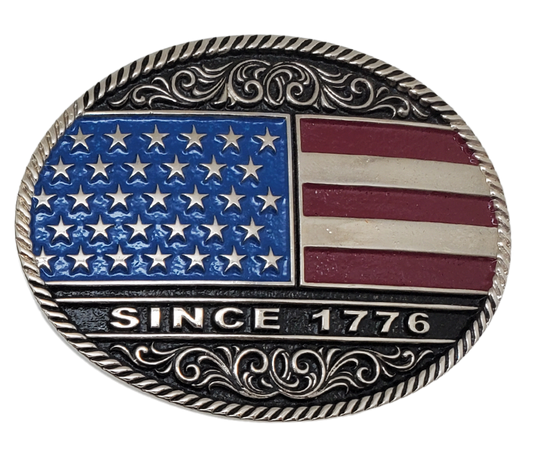 Be a true patriot with The "Declaration" Belt Buckle, featuring a timeless Western Scroll pattern, a rope edge, and iconic Red, White, and Blue colors. Its Antiqued silver finish and easy-to-wear oval shape make it a must-have for any belt measuring 1 1/2" wide. Find it online or at our shop near Nashville in Smyrna, TN. Crafted from durable metal alloy and coated with Montana Armor for long-lasting wear.