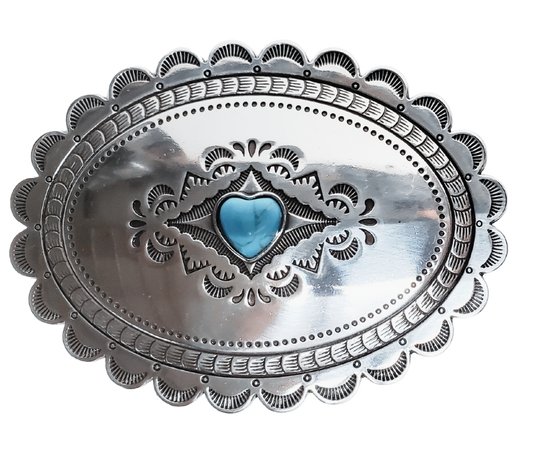 A southwest classic style oval Concho design that has a hand stamped appearance. The scalloped edge border sets it off around the edge. It is Antique silver in it's finish with a Small Heart shaped Turquoise colored stone in the center. with scroll design etched appearance on surface.  Measures approx. 3" tall by 4" wide and fits belts up to 1 1/2" wide.  It is available for purchase in our retail shop in Smyrna, TN, just outside Nashville and also on the online store. 