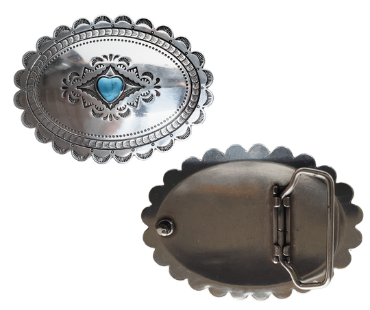 A southwest classic style oval Concho design that has a hand stamped appearance. The scalloped edge border sets it off around the edge. It is Antique silver in it's finish with a Small Heart shaped Turquoise colored stone in the center. with scroll design etched appearance on surface.  Measures approx. 3" tall by 4" wide and fits belts up to 1 1/2" wide.  It is available for purchase in our retail shop in Smyrna, TN, just outside Nashville and also on the online store. 