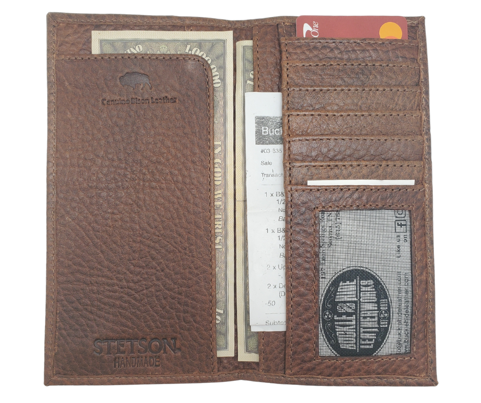 Fully Licensed Stetson Logo Roper/Checkbook style Wallet. Made from Genuine Bison Leather inside and out in a Classic Roper Design. Featuring on the right inside 6 card slots and I.D. pocket along with 2 underside pockets. On the left inside 1 cash pocket. In stock at our Smyrna, TN retail store 30 min. from downtown Nashville. Imported.