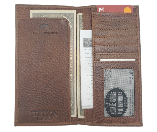 Fully Licensed Stetson Logo Roper/Checkbook style Wallet. Made from Genuine Bison Leather inside and out in a Classic Roper Design. Featuring on the right inside 6 card slots and I.D. pocket along with 2 underside pockets. On the left inside 1 cash pocket. In stock at our Smyrna, TN retail store 30 min. from downtown Nashville. Imported.