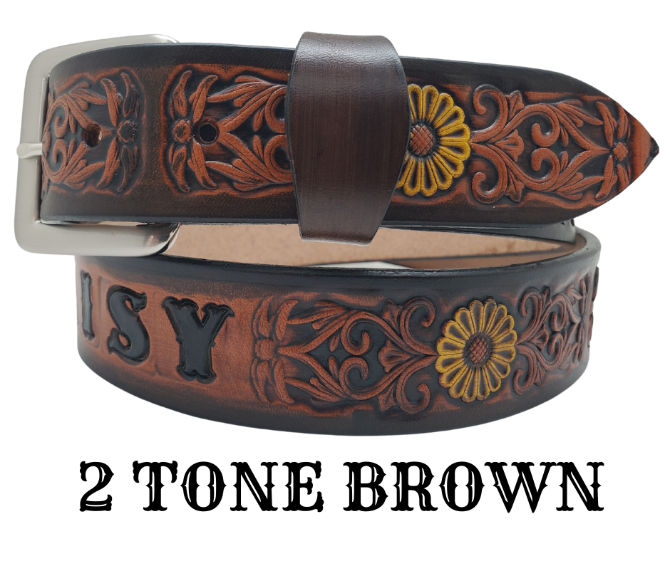 "The Sun Daisy" is a handmade real VEGTAN belt made from a single strip of cowhide shoulder leather that is 8-10 oz. or approx. 1/8" thick. It has hand burnished (smoothed)&nbsp;edges and Summer flowers embossed on the surface with HAND PAINTED in White and Yellow or White or Yellow. The antique nickel plated solid brass buckle is snapped in place with heavy snaps.&nbsp; This belt is made just outside Nashville in Smyrna, TN.