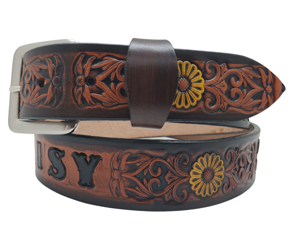 "The Sun Daisy" is a handmade real VEGTAN belt made from a single strip of cowhide shoulder leather that is 8-10 oz. or approx. 1/8" thick. It has hand burnished (smoothed)&nbsp;edges and Summer flowers embossed on the surface with HAND PAINTED in White and Yellow or White or Yellow. The antique nickel plated solid brass buckle is snapped in place with heavy snaps.&nbsp; This belt is made just outside Nashville in Smyrna, TN.