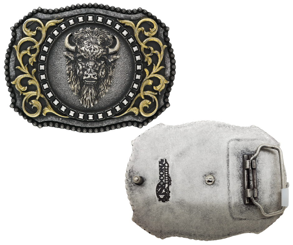 The Buffalo, a beloved Western symbol, now has a stylish and approachable accessory to complete your look. This rectangular belt buckle features a Brass-colored western scroll design with a Tantanka head in the center, surrounded by rounded bead edges. Measuring 3" tall by 4" wide, it's perfectly sized to fit belts up to 1 1/2" wide. You can find it at our retail shop in Smyrna, TN, located just outside of Nashville, or online.