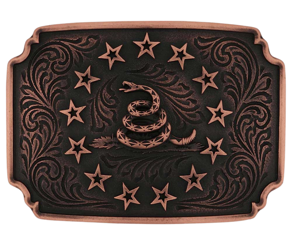 Pack a punch wherever you go with the Founders Buckle. A rose gold finished Gadsden snake sits prominently in the center of the buckle with a border of rose gold finished stars encircling it. A dark antiquing on the rose gold finished backdrop with filigree etching provides a memorizing contrast. A rose gold plated edge borders the entire buckle. Standard 1.5 inch swivel. Get yours at our local Smyrna, TN not far from Nashville.