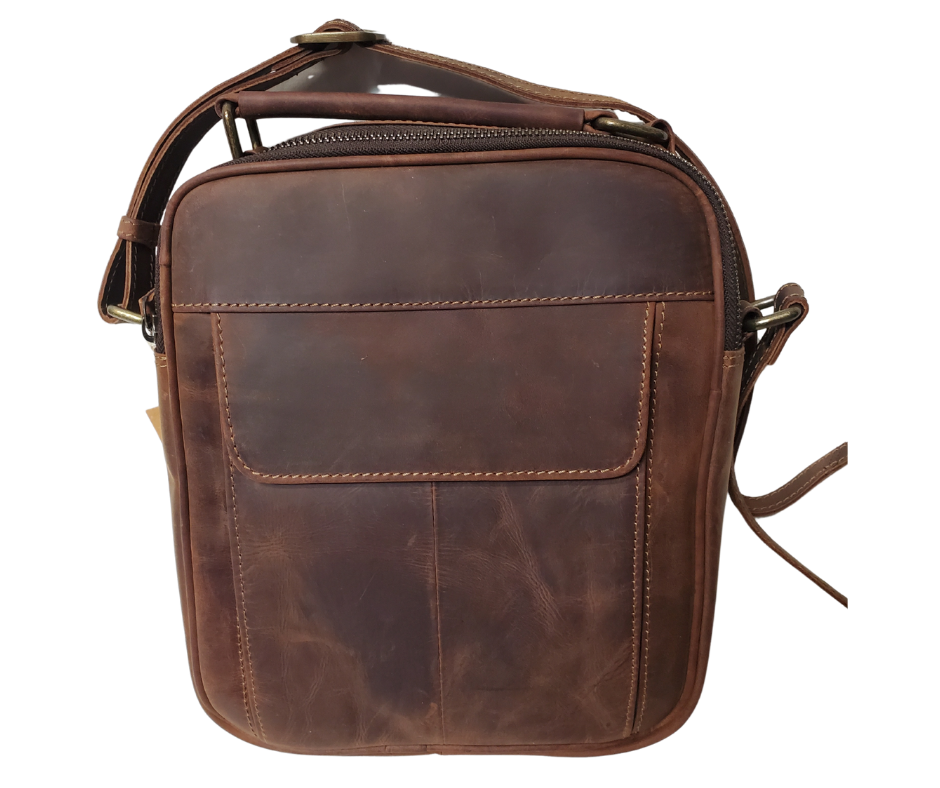 The Businessman Leather Tablet Bag, features a 54" adjustable crossbody strap, a comfortable handle at top, zippered back pocket, an organizing front pocket with 1 open pocket and 4 card slots, and closes with a magnetic catch at end of a flap. Main compartment zips closed. Inside is 1 zip pocket, 1 open pocket, and is lined with a sturdy fabric. See them at our Smyrna, TN shop not far from Nashville.
Bag Size 9.5” x 8.25” x 2.75”
54" Adjustable Strap