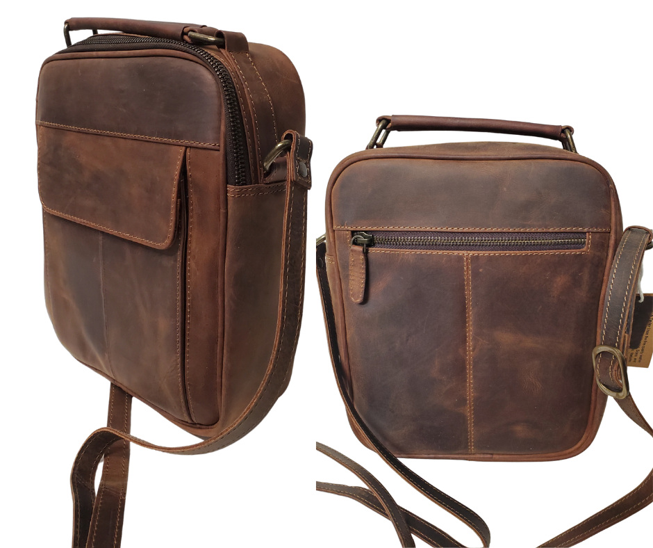 The Businessman Leather Tablet Bag, features a 54" adjustable crossbody strap, a comfortable handle at top, zippered back pocket, an organizing front pocket with 1 open pocket and 4 card slots, and closes with a magnetic catch at end of a flap. Main compartment zips closed. Inside is 1 zip pocket, 1 open pocket, and is lined with a sturdy fabric. See them at our Smyrna, TN shop not far from Nashville.
Bag Size 9.5” x 8.25” x 2.75”
54" Adjustable Strap