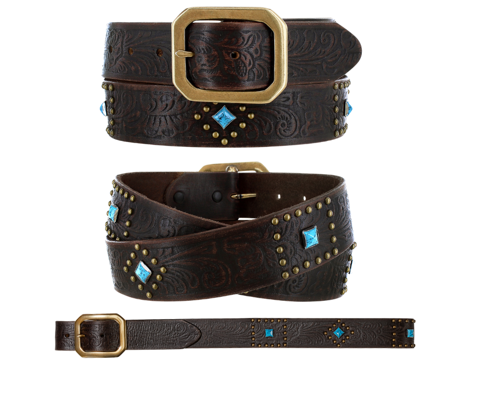 The rich leather belt strap has Western pattern floral embossing in dark brown accented with small round gold studs in a Diamond shaped pattern, a diamond shaped Turquoise colored stone, completed with a Clipped corner square buckle. It has snaps for easy buckle change. This chocolate brown color will match and go with a lot of boots and outfits and is available at our Smyrna, TN shop not far from Nashville.