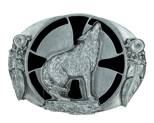 The Howling Wolf gives an at-the-ready feel with a howling wolf squatting before a black enameled Maltese cross and flanked by two feather ornaments. This pewter colored buckle fits 1 1/2" wide belt and is about 3 1/2"W x 2 3/4"H. Available in our shop just outside Nashville in Smyrna, TN