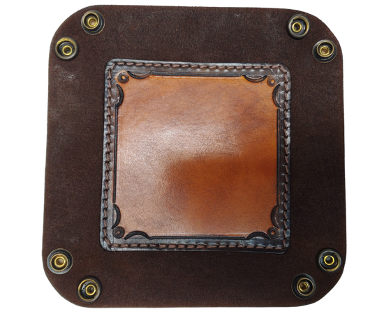 The Franklin is a stylish handmade real leather "catchall" valet tray is made from 2 layers of cowhide leather. It's a little different than our other trays because of the Hand Stamped and stained inside layer. Outer layer is a Bison brown color with the inside layer being stitched in. The corners are held together with heavy line 24 Antique Brass colored snaps, for laying flat for travel, a place for placing keys, wallet, coins.  Made in our shop just outside Nashville in Smyrna, TN.