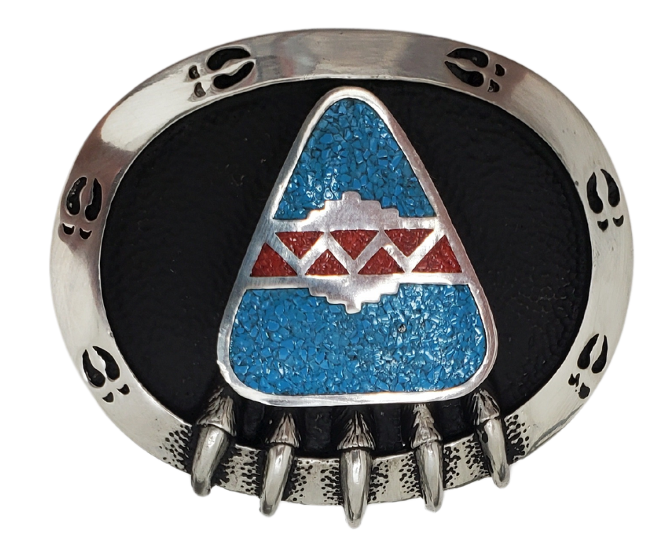 The symbol of the Bear Claw is thought to carry power and strength. This beautiful Buckle made of lead-free pewter with turquoise &amp; coral chip inlay. It's available in our shop located just outside of Nashville in Smyrna, TN.

3 in x 2.375 in.
Made in the USA.